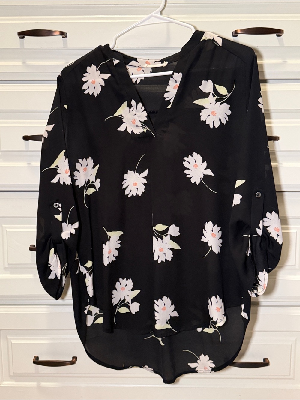 Lush Black Floral V-Neck Blouse with White and Pale Pink Blooms